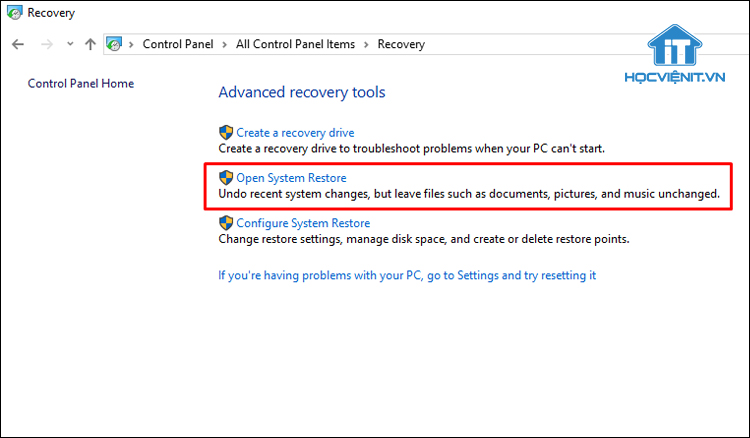 Nhấn vào Open System Restore